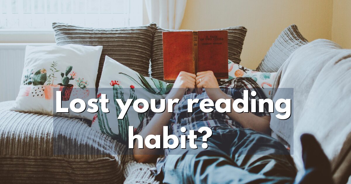 An image of a person reading a book while sleeping on the couch for an article on how to start reading books again and build a consistent reading habit