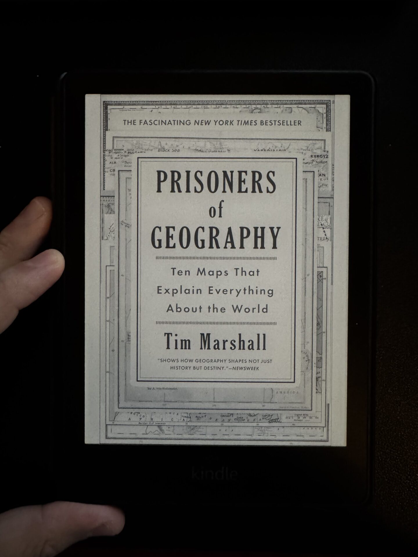 A kindle cover image of the book Prisoners of Geography by Tim Marshall for a book review written by Tapan Desai