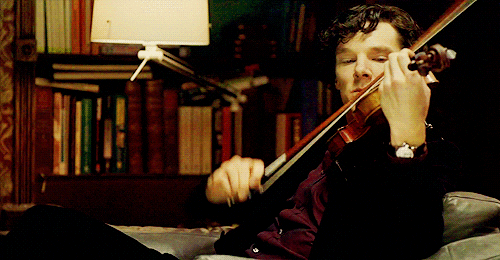 A gif from the BBC series "Sherlock," where Sherlock Holmes, played by Benedict Cumberbatch, is seen playing the violin and is in the diffused mode of thinking.