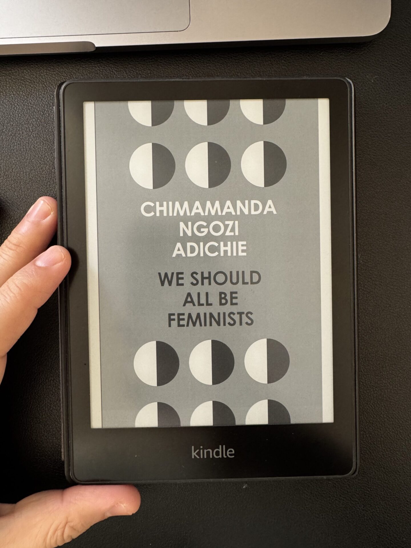 A Kindle cover photo of the book We Should All Be Feminists. The book review is written by Tapan Desai.