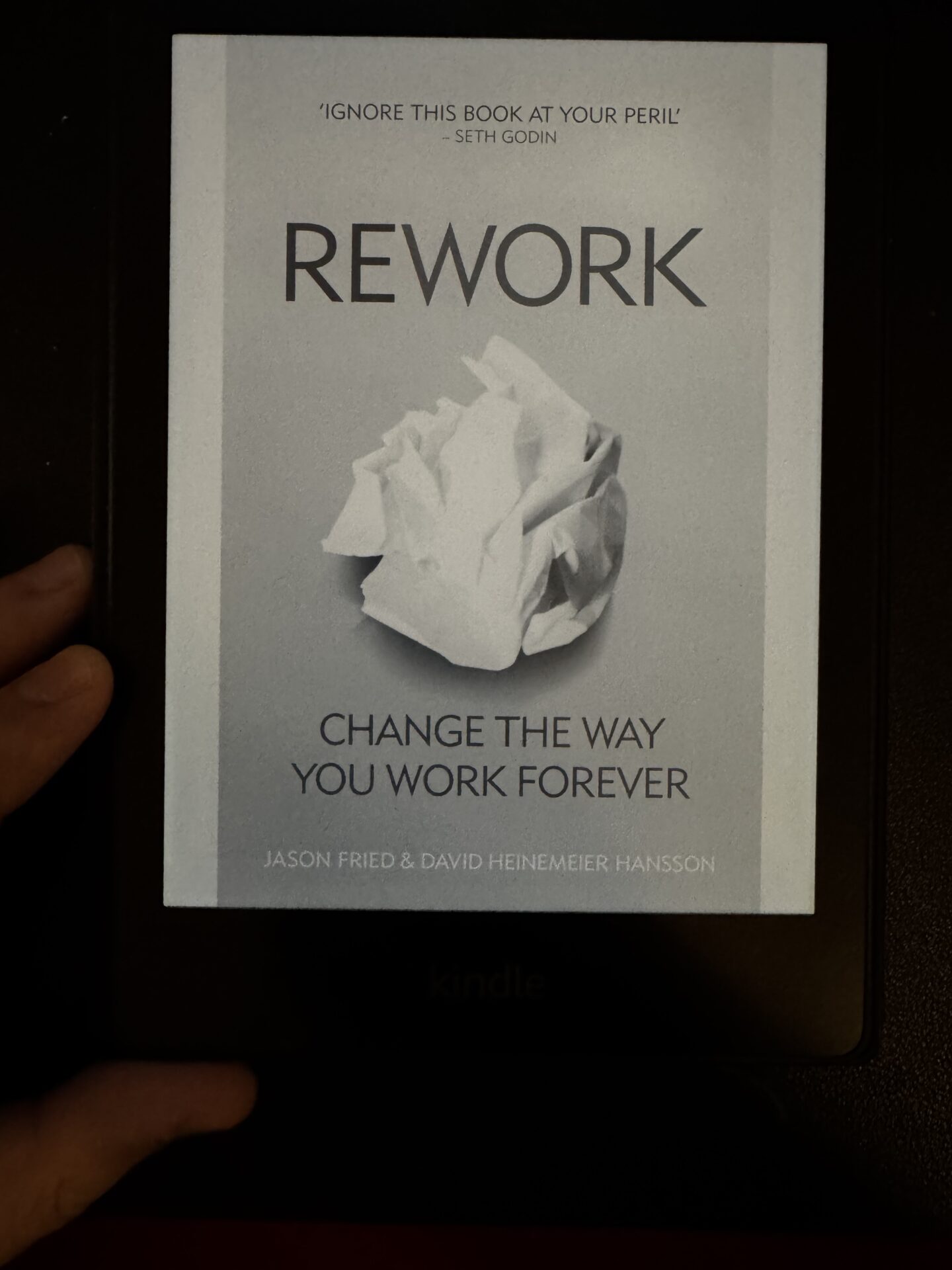 An image of the kindle cover of the book Rework by Jason Fried for a book summary written by Tapan Desai