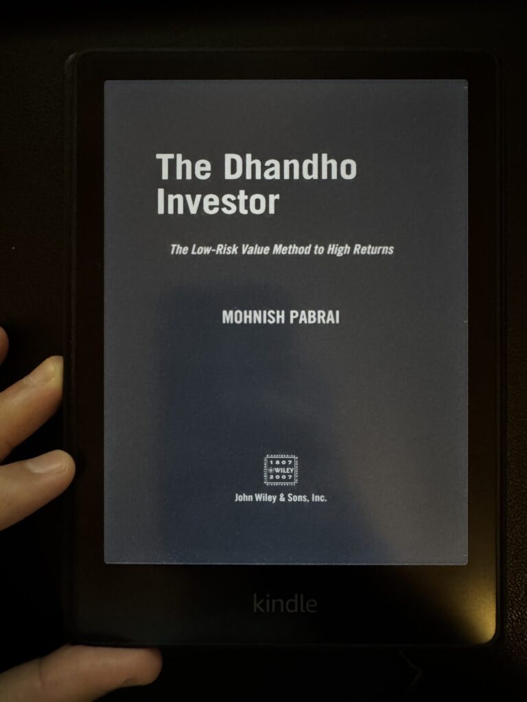 A Kindle book cover of Mohnish Pabrai's book, the Dhandho Investor for a book summary explaining the dhandho approach and key lessons from the book.